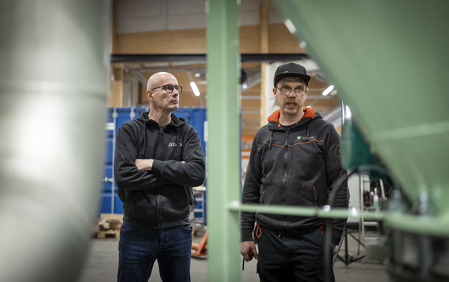 Filtrabit CPO Jyri Tolonen and Volter Project Director Iikka Ylikoski inspecting a Filtrabit unit in assembly.